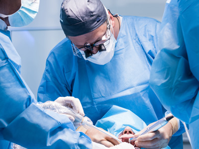 A dental team performing a dental implant surgery
